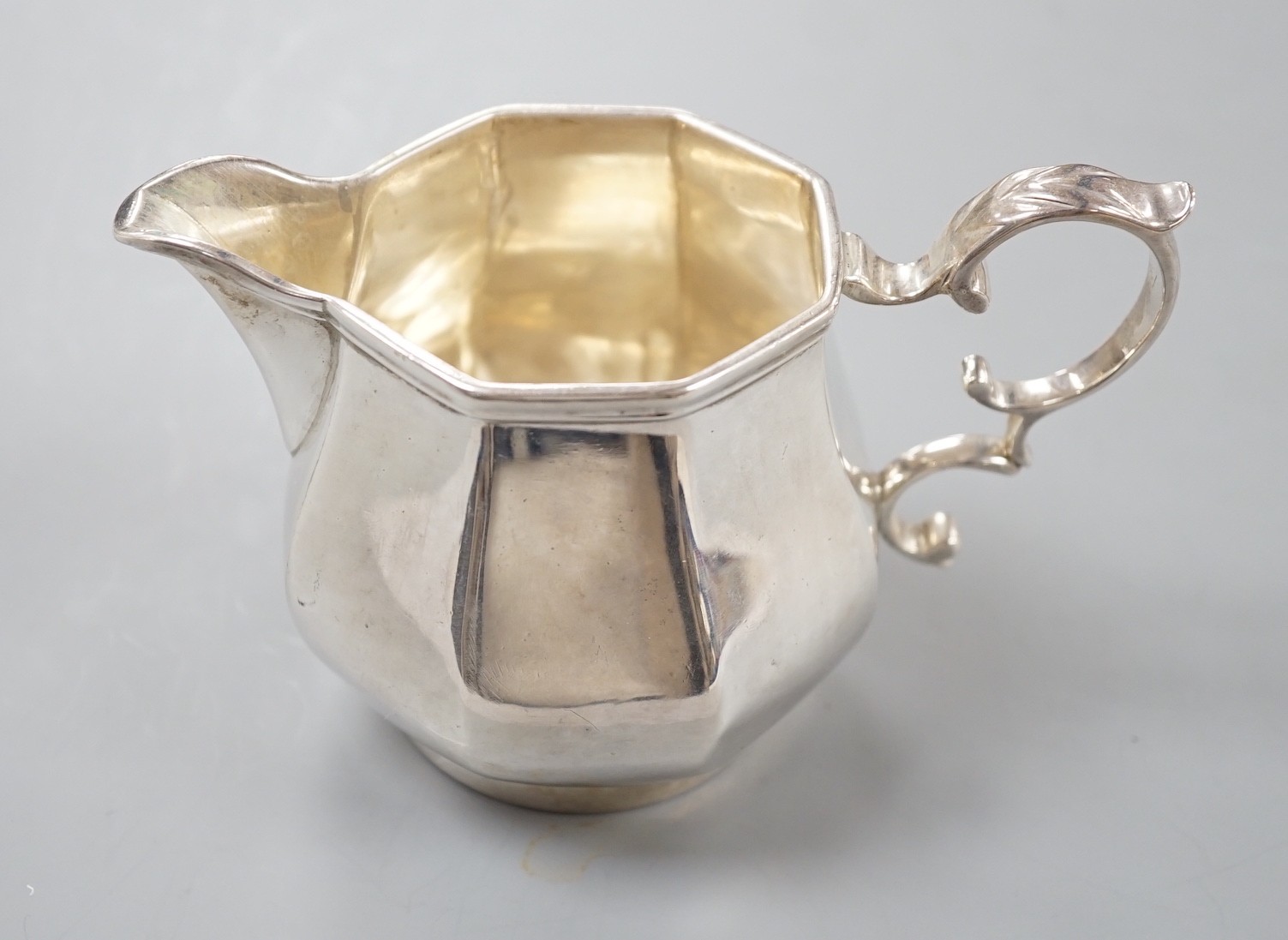 A George V silver panelled cream jug, Charles Stuart Harris & Sons, London, 1916, 82mm, 6.5oz.